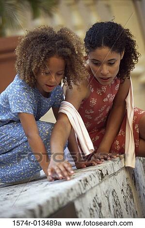 Mother playing with her daughter View Large Photo Image Stock Image - Mother playing with her daughter. Fotosearch
