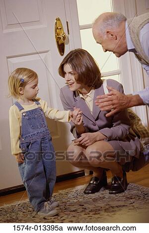 Mother talking to her daughter with her grandfather standing beside her View Large Photo Image Stock Image - Mother talking to her daughter with her grandfather standing beside her. Fotosearch
