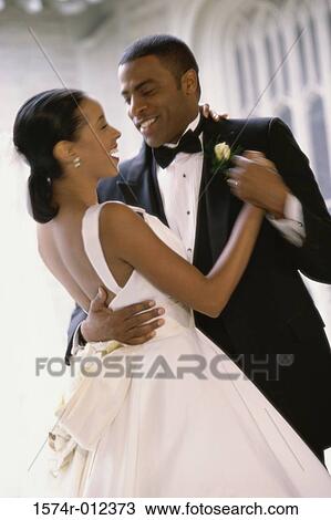 Stock Image - Newlywed couple dancing. Fotosearch