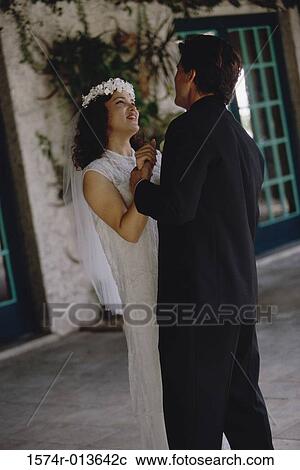 Stock Image - Newlywed couple dancing. Fotosearch