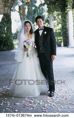 Picture - Newlywed couple laughing. Fotosearch