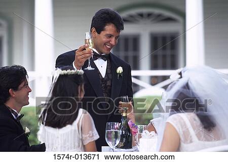 Newlywed couple with their wedding guests View Large Photo Image Stock Image - Newlywed couple with their wedding guests. Fotosearch