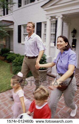 Parents walking with their son and daughter View Large Photo Image Stock Image - Parents walking with their son and daughter. Fotosearch