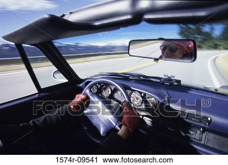 Person driving a convertible car View Large Photo Image Stock Image - Person driving a convertible car. Fotosearch