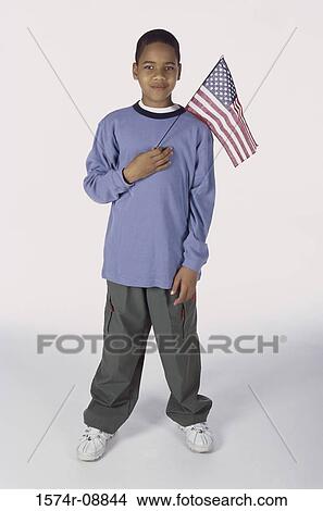 Picture - Portrait of a boy holding an American flag. Fotosearch