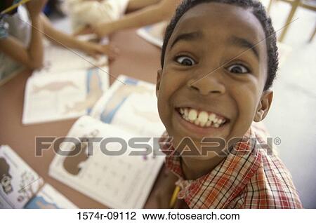 Portrait of a boy making a face View Large Photo Image Stock Image - Portrait of a boy making a face. Fotosearch