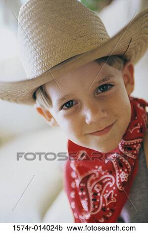 Portrait of a boy wearing a cowboy hat View Large Photo Image Stock Image - Portrait of a boy wearing a cowboy hat. Fotosearch