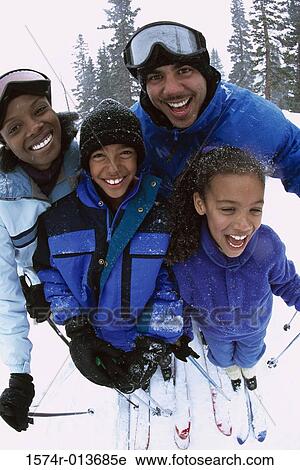 Portrait of a brother and sister with their parents skiing View Large Photo Image Stock Image - Portrait of a brother and sister with their parents skiing. Fotosearch