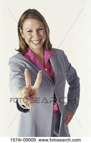 Portrait of a businesswoman showing the victory sign View Large Photo Image Stock Photo - Portrait of a businesswoman showing the victory sign. Fotosearch
