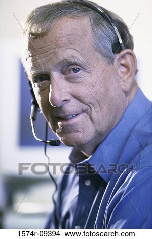 Picture - Portrait of a customer service representative wearing a headset. Fotosearch