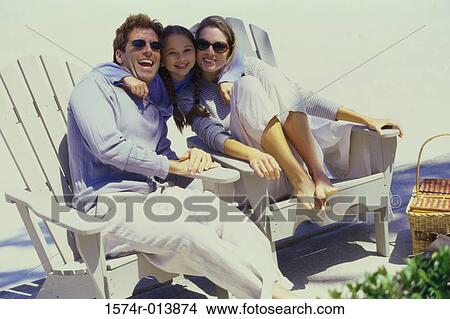 Picture - Portrait of a daughter hugging her parents. Fotosearch