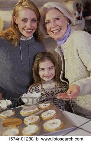 Portrait of a daughter smiling with her mother and grandmother View Large Photo Image Stock Image - Portrait of a daughter smiling with her mother and grandmother. Fotosearch