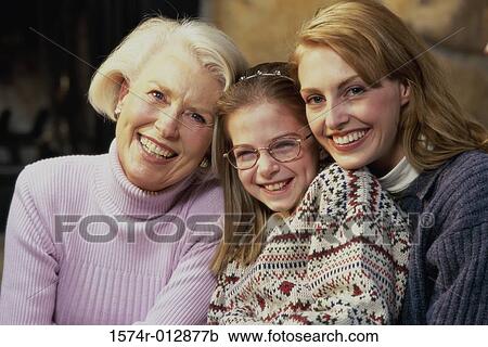 Stock Image - Portrait of a daughter with her mother and grandmother smiling. Fotosearch