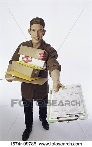 Stock Photograph - Portrait of a delivery man making a delivery. Fotosearch