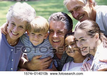 Stock Image - Portrait of a family smiling. Fotosearch