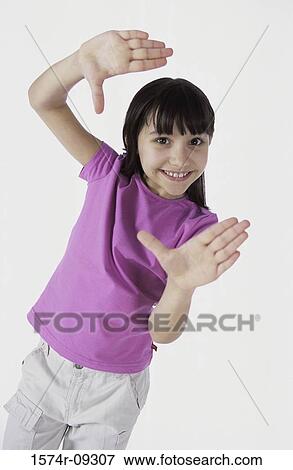 Stock Photo - Portrait of a girl gesturing with her hands. Fotosearch