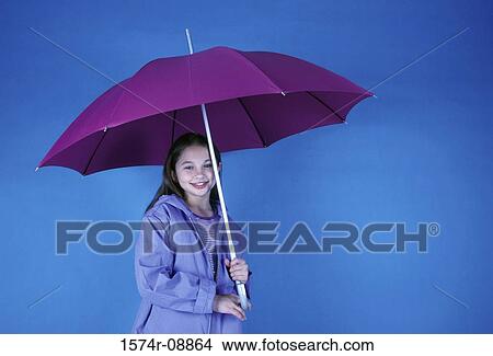 Portrait of a girl holding an umbrella View Large Photo Image Picture - Portrait of a girl holding an umbrella. Fotosearch