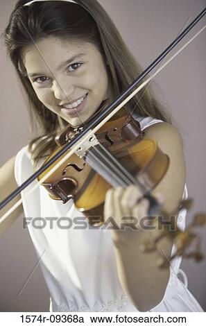 Portrait of a girl playing a violin View Large Photo Image Stock Image - Portrait of a girl playing a violin. Fotosearch