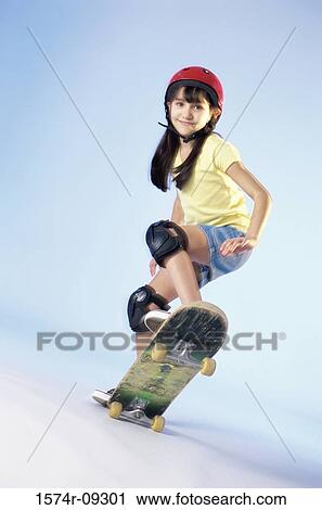 Portrait of a girl riding a skateboard View Large Photo Image Stock Image - Portrait of a girl riding a skateboard. Fotosearch