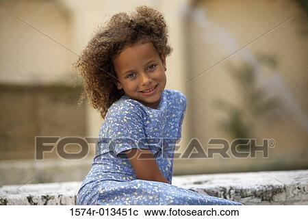 Portrait of a girl sitting View Large Photo Image Stock Image - Portrait of a girl sitting. Fotosearch