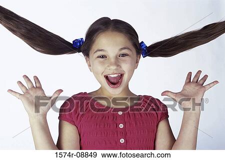 Portrait of a girl smiling with her hands raised View Large Photo Image Stock Photo - Portrait of a girl smiling with her hands raised. Fotosearch