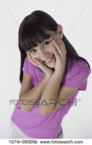 Portrait of a girl with her hands on her cheeks View Large Photo Image Stock Image - Portrait of a girl with her hands on her cheeks. Fotosearch