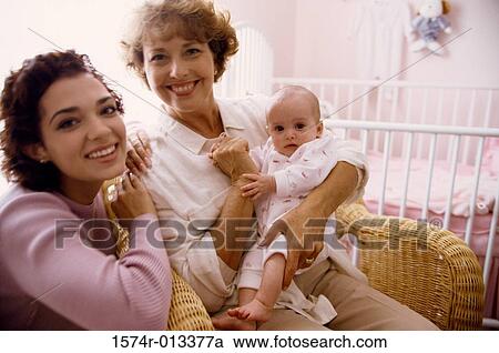 Portrait of a grandmother smiling with her daughter and granddaughter View Large Photo Image Stock Image - Portrait of a grandmother smiling with her daughter and granddaughter. Fotosearch