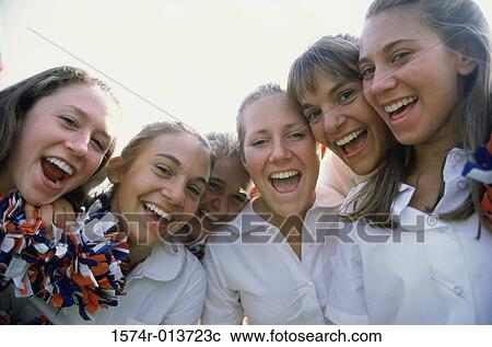 Stock Image - Portrait of a group of teenage girls smiling. Fotosearch