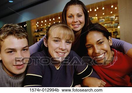 Portrait of a group of teenagers smiling View Large Photo Image Stock Image - Portrait of a group of teenagers smiling. Fotosearch