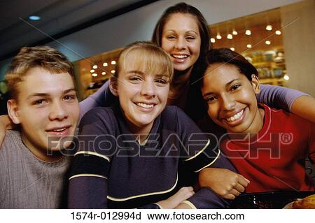 Portrait of a group of teenagers smiling View Large Photo Image Stock Image - Portrait of a group of teenagers smiling. Fotosearch