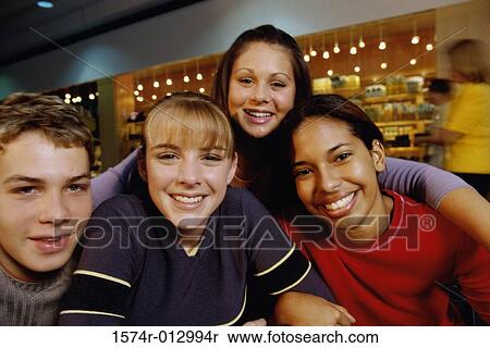 Stock Photography - Portrait of a group of teenagers smiling. Fotosearch