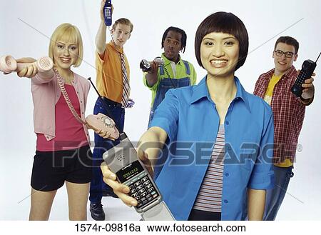 Portrait of a group of young people holding telephones View Large Photo Image Stock Image - Portrait of a group of young people holding telephones. Fotosearch