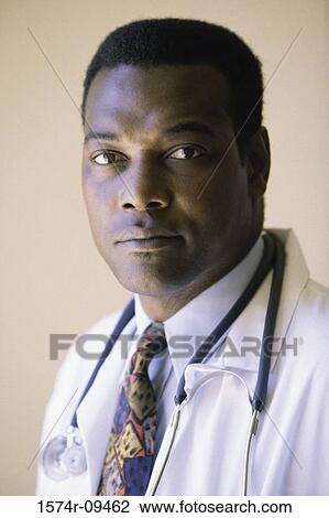 Portrait of a male doctor with a stethoscope around his neck View Large Photo Image Stock Image - Portrait of a male doctor with a stethoscope around his neck. Fotosearch