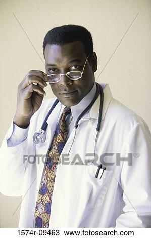 Portrait of a male doctor with a stethoscope View Large Photo Image Stock Image - Portrait of a male doctor with a stethoscope. Fotosearch