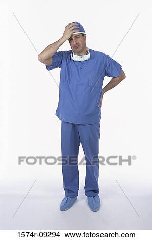 Picture - Portrait of a male doctor with his hand on his head. Fotosearch