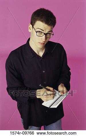 Portrait of a man writing a check View Large Photo Image Stock Photograph - Portrait of a man writing a check. Fotosearch
