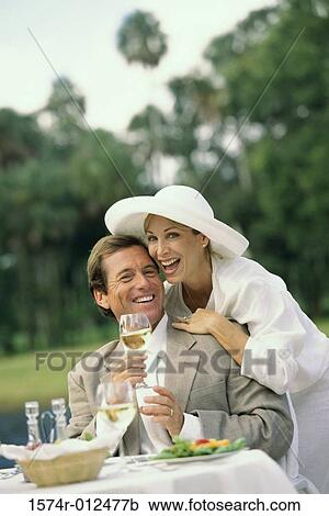 Portrait of a mature man holding a wineglass with a mature woman View Large Photo Image Stock Image - Portrait of a mature man holding a wineglass with a mature woman. Fotosearch