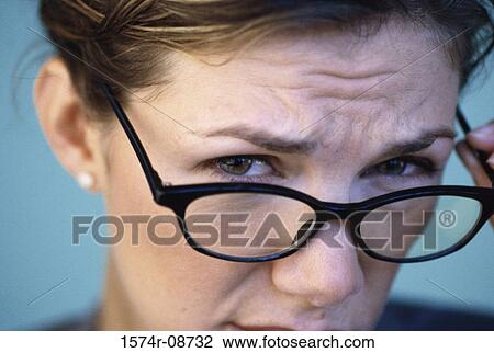 Portrait of a mid adult woman wearing eyeglasses View Large Photo Image Stock Image - Portrait of a mid adult woman wearing eyeglasses. Fotosearch