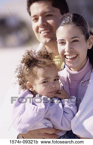 Portrait of a mother and father with their daughter View Large Photo Image Stock Image - Portrait of a mother and father with their daughter. Fotosearch