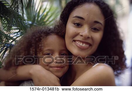 Portrait of a mother hugging her daughter View Large Photo Image Stock Image - Portrait of a mother hugging her daughter. Fotosearch