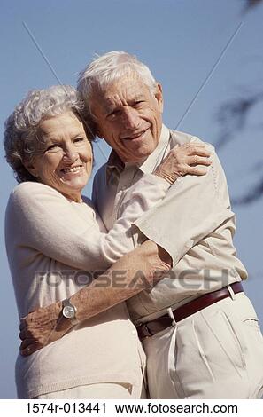 Portrait of a senior couple embracing each other View Large Photo Image Stock Image - Portrait of a senior couple embracing each other. Fotosearch