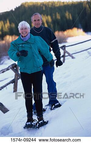 Portrait of a senior couple snowshoeing View Large Photo Image Picture - Portrait of a senior couple snowshoeing. Fotosearch