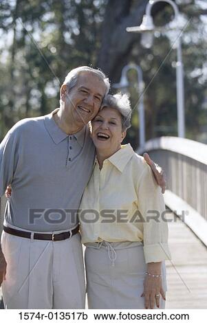 Portrait of a senior couple standing together View Large Photo Image Stock Image - Portrait of a senior couple standing together. Fotosearch