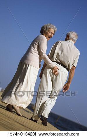 Portrait of a senior woman flirting with a senior man View Large Photo Image Stock Image - Portrait of a senior woman flirting with a senior man. Fotosearch