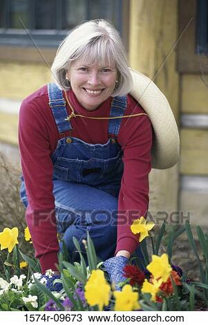 Portrait of a senior woman gardening View Large Photo Image Stock Image - Portrait of a senior woman gardening. Fotosearch
