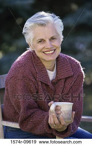 Portrait of a senior woman smiling View Large Photo Image Stock Photo - Portrait of a senior woman smiling. Fotosearch