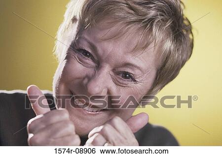 Portrait of a senior woman smiling View Large Photo Image Stock Photograph - Portrait of a senior woman smiling. Fotosearch