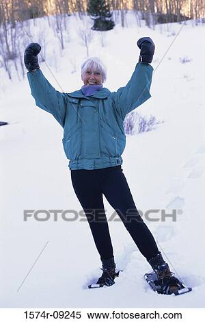 Portrait of a senior woman with her arms raised View Large Photo Image Stock Photography - Portrait of a senior woman with her arms raised. Fotosearch