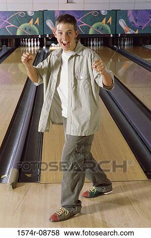 Portrait of a teenage boy in a bowling alley View Large Photo Image Stock Photo - Portrait of a teenage boy in a bowling alley. Fotosearch