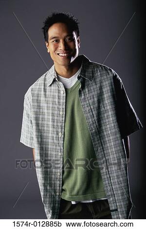 Portrait of a teenage boy smiling View Large Photo Image Stock Image - Portrait of a teenage boy smiling. Fotosearch